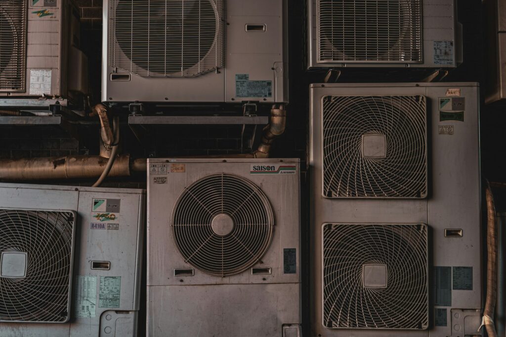 a-bunch-of-air-conditioners-stacked-on-top-of-each-other